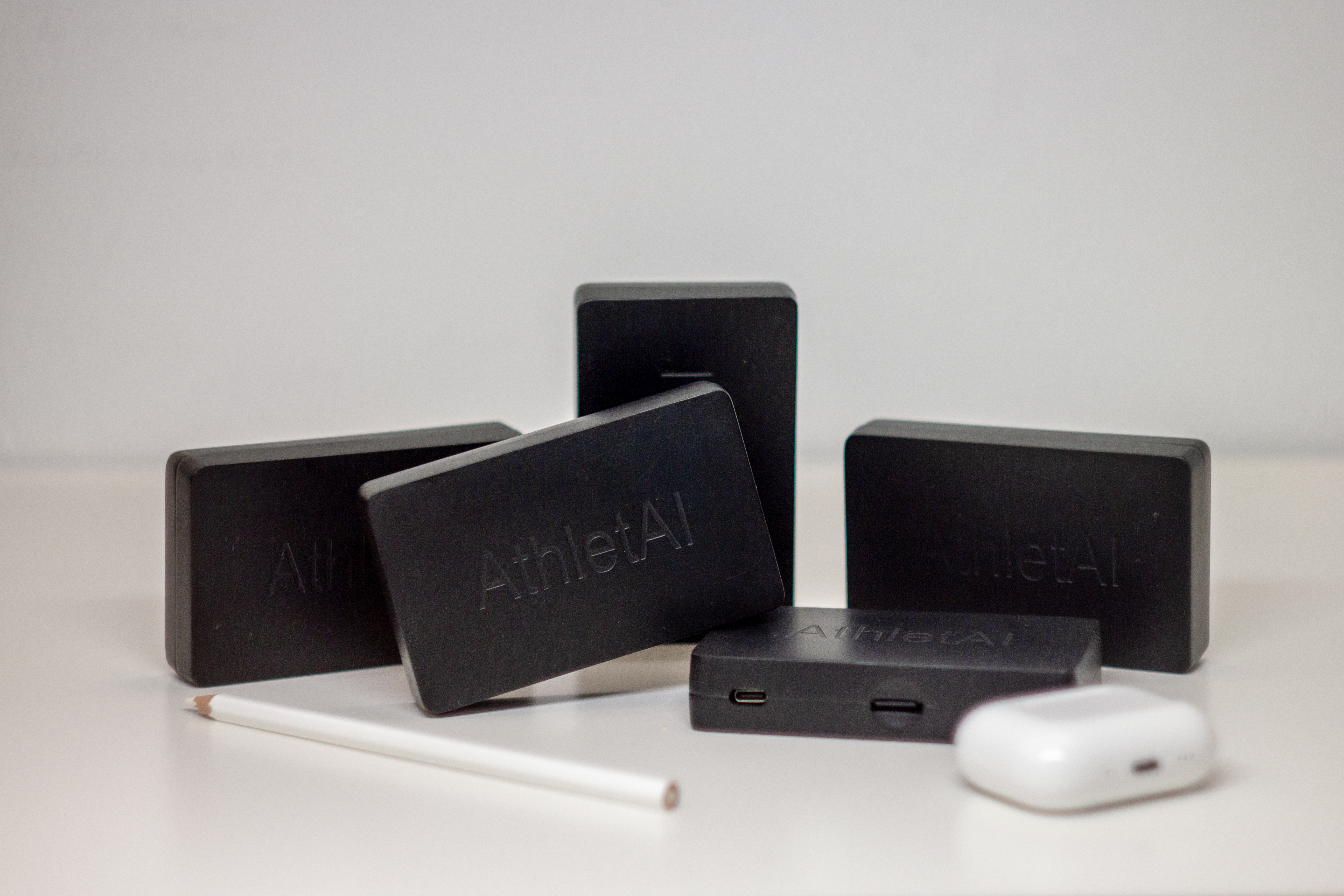 AthletAI sensor prototypes photographed in studio conditions